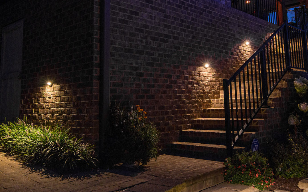 brick steps in backyard lit with low voltage step lights