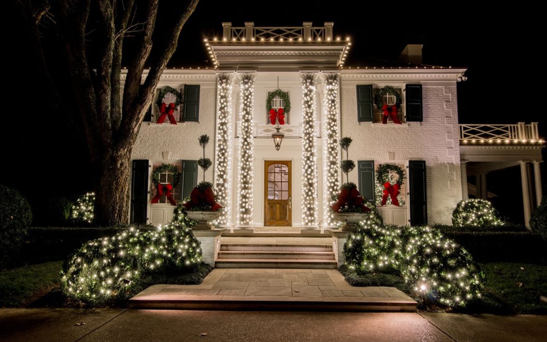 Christmas lights wrapped on columns of home