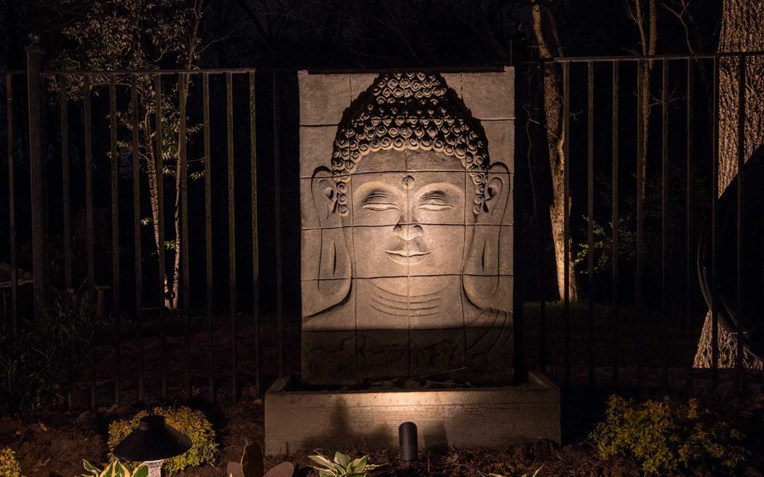 Accent uplighting on garden statue