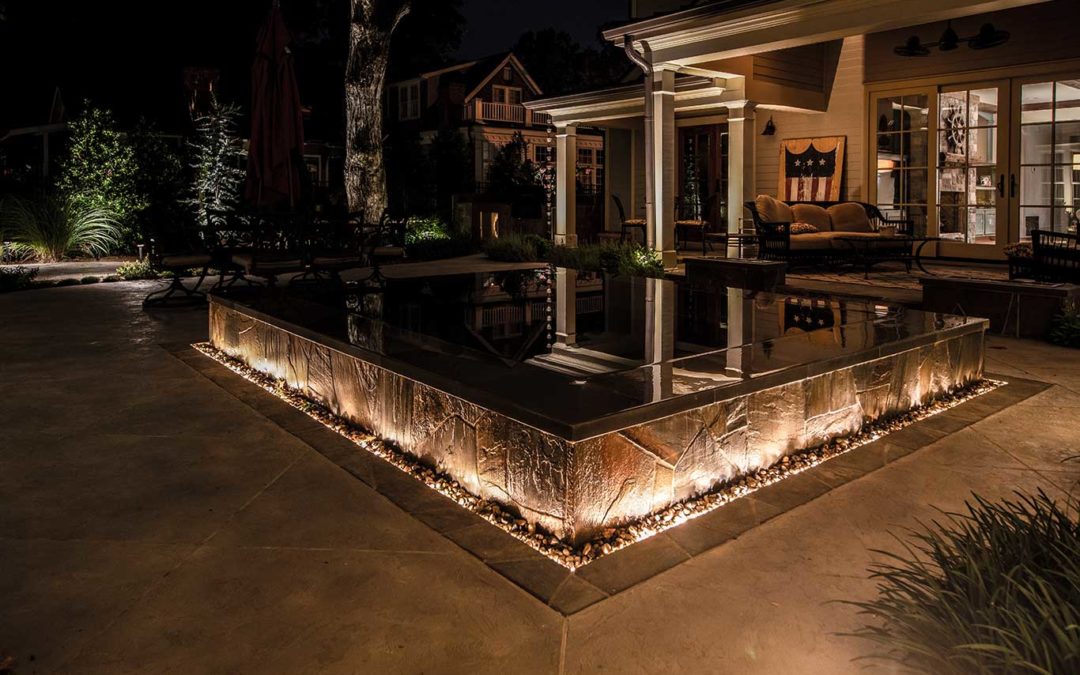 backyard courtyard lighting around infinity hot tub