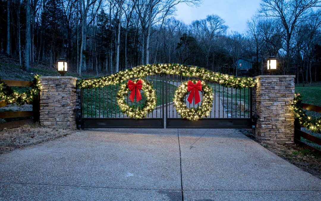 professional holiday lights and greenery on gate