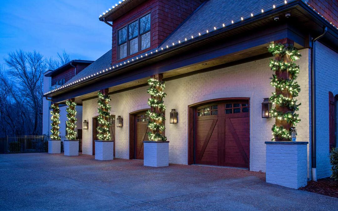 wood columns wrapped in lit garland