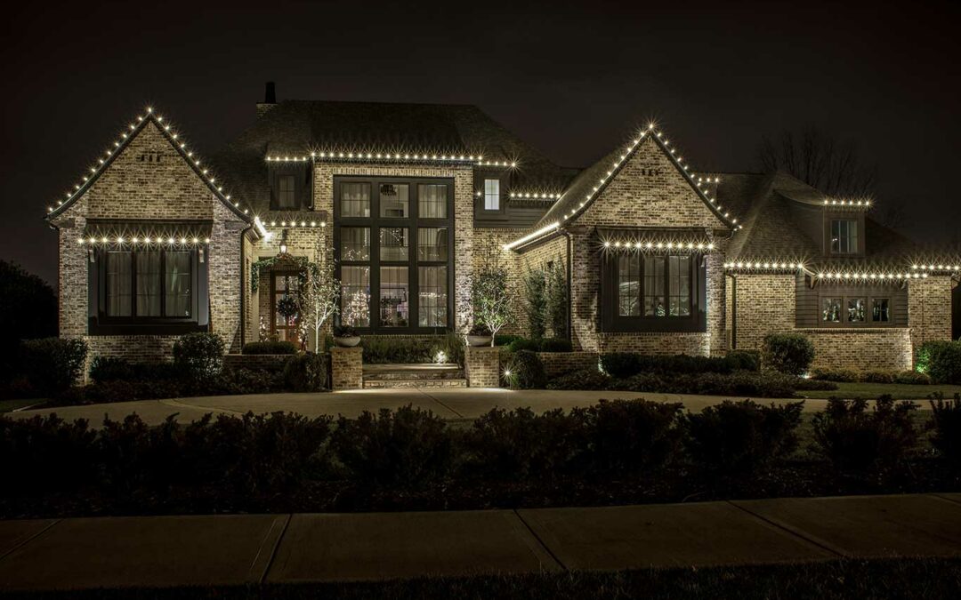 large home with tasteful holiday light on roofline