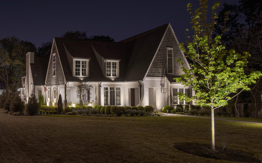 white brick home with architectural lighting