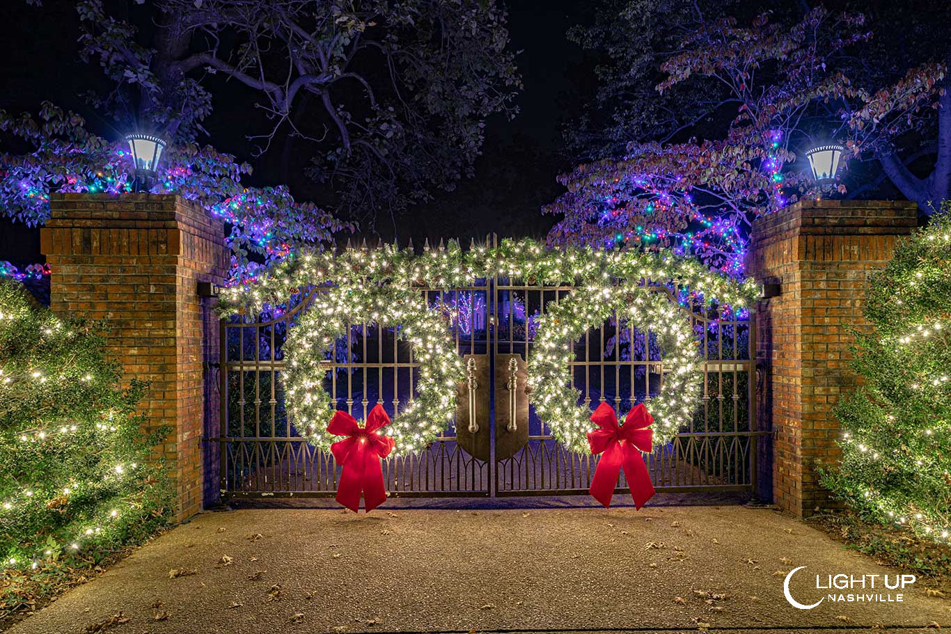 Entrance Gate Decorated in Christmas Lights and Greenery